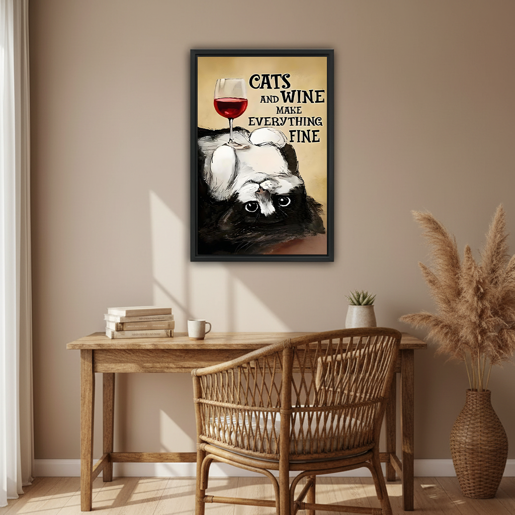 Funny cat wine quote framed wall art in black frame above rustic wooden desk with rattan chair in boho home office