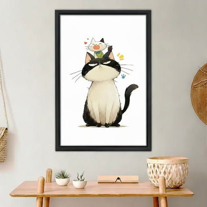 Grumpy cat and kitten funny wall art print in black frame above wooden desk, cute Japanese-style illustration