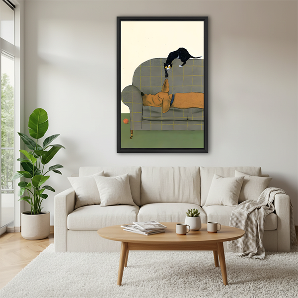 Black framed cat and dog illustration print above a white sofa in a Scandinavian living room, funny pet wall art decor