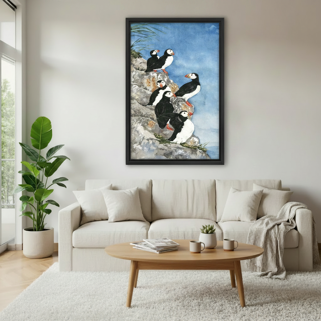 Puffin watercolor framed canvas wall art above beige sofa in bright living room, coastal bird nature print decor
