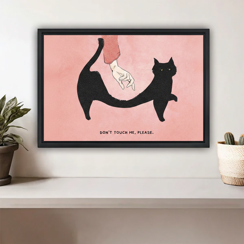 Don't Touch Me Please black cat minimalist framed canvas wall art in black frame above a white shelf with potted plants