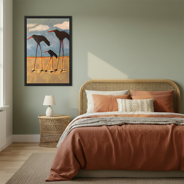 Shorebird family oil painting framed canvas art in black frame above rattan bed with terracotta bedding in sage green bedroom