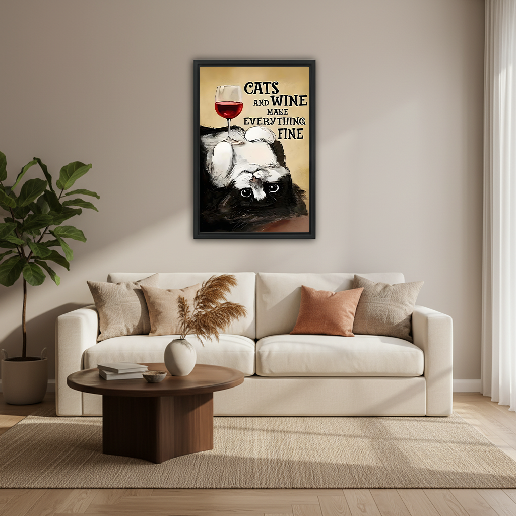Cats and wine funny quote canvas art in black frame above cream sofa in modern Scandinavian living room
