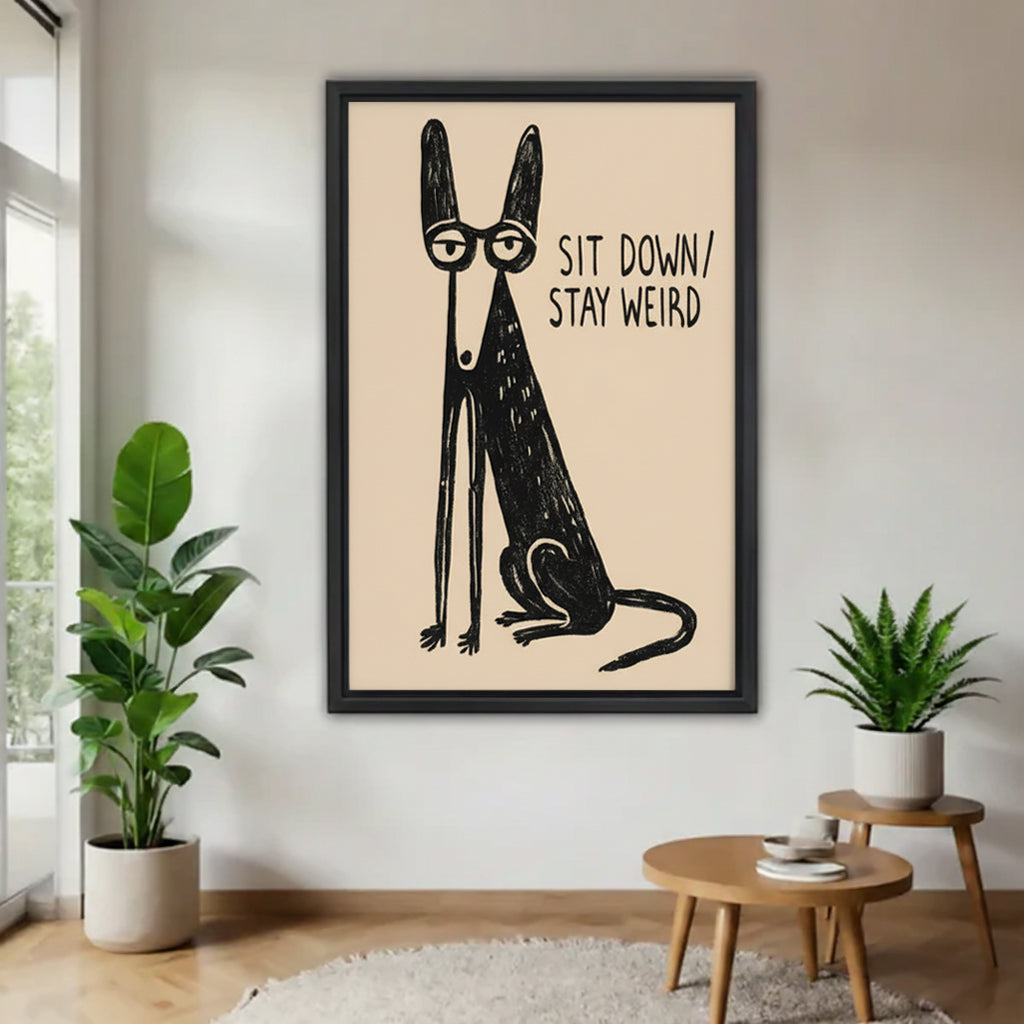 Quirky dog 'Sit Down Stay Weird' framed wall art print in modern living room with plants