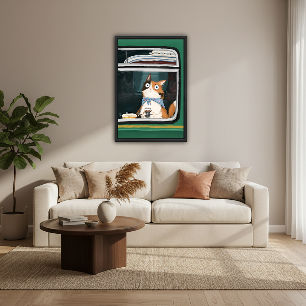 Cat on vintage train framed wall art print displayed above a cream sofa in a modern neutral living room