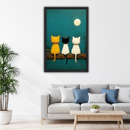 Whimsical three cats watching moon canvas print above living room sofa
