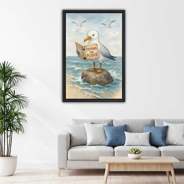 Witty seagull reading book framed wall art above gray sofa in bright living room — beach humor decor
