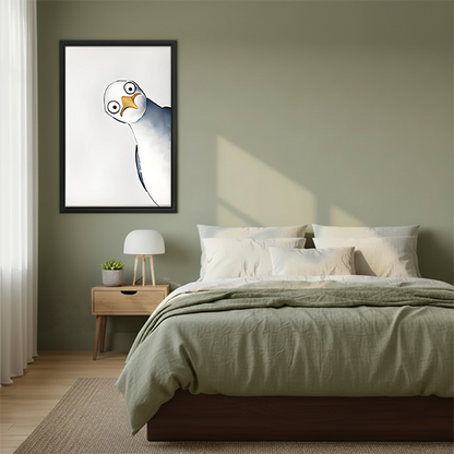 Tilted seagull watercolor framed wall art with wide-eyed quirky bird hung on sage green wall above wooden bed with linen bedding in Scandinavian bedroom