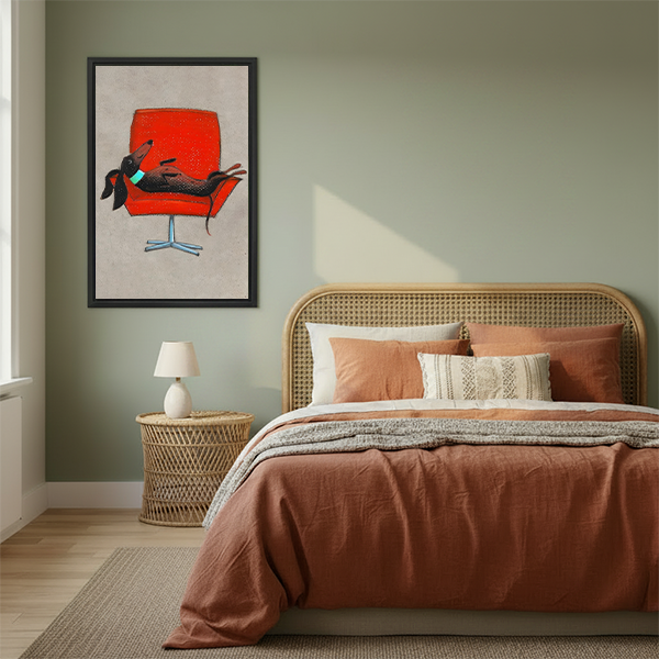 Whimsical dachshund on red retro chair framed canvas wall art hanging in cozy boho bedroom above rattan bed with terracotta bedding