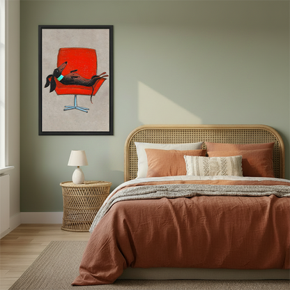 Whimsical dachshund on red retro chair framed canvas wall art hanging in cozy boho bedroom above rattan bed with terracotta bedding