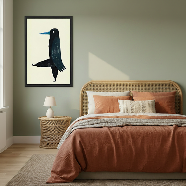 Minimalist black crow blue beak framed canvas art in black frame above rattan bed with terracotta bedding in sage green bedroom