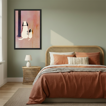 Whimsical dalmatian dog and puppy framed canvas wall art hanging in cozy boho bedroom above rattan bed with terracotta bedding and rattan nightstand
