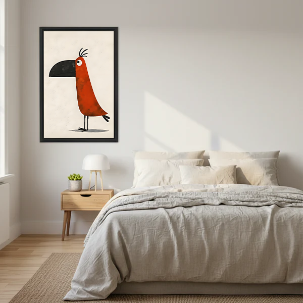 Funny whimsical toucan framed wall art print in black frame above a bed with linen bedding in a Scandinavian bedroom