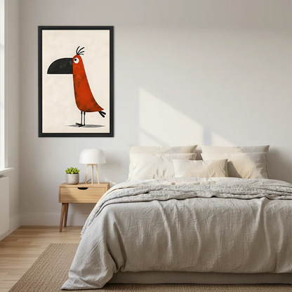 Funny whimsical toucan framed wall art print in black frame above a bed with linen bedding in a Scandinavian bedroom