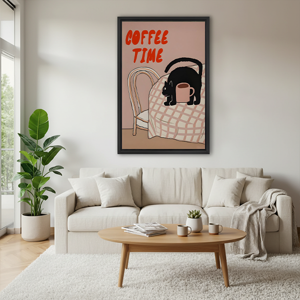 Black-framed Coffee Time black cat canvas wall art showing a cat on a checkered table, displayed beside plants.