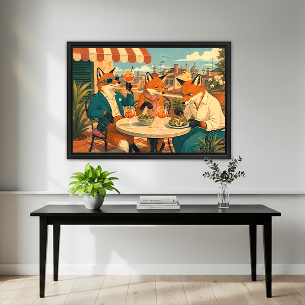 Black-framed foxes dining on a terrace canvas wall art above a wooden console with decorative vases.