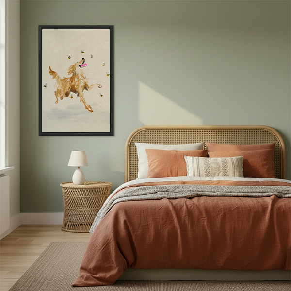 Whimsical golden retriever with bees watercolor framed canvas wall art hanging in cozy boho bedroom above rattan bed with terracotta bedding and rattan nightstand