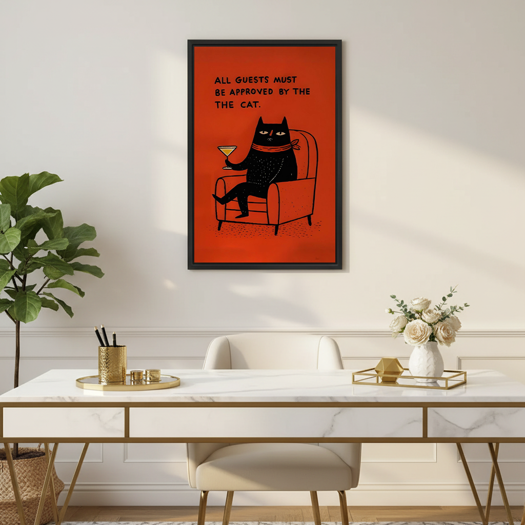 Framed funny black cat cocktail canvas wall art above a desk, featuring a seated cat and bright red-orange backdrop.
