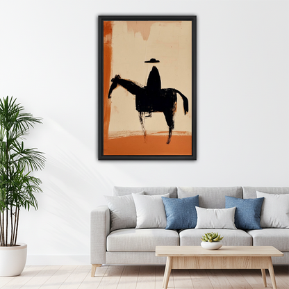Bold cowboy silhouette abstract framed wall art above gray sofa — earthy minimalist home decor
