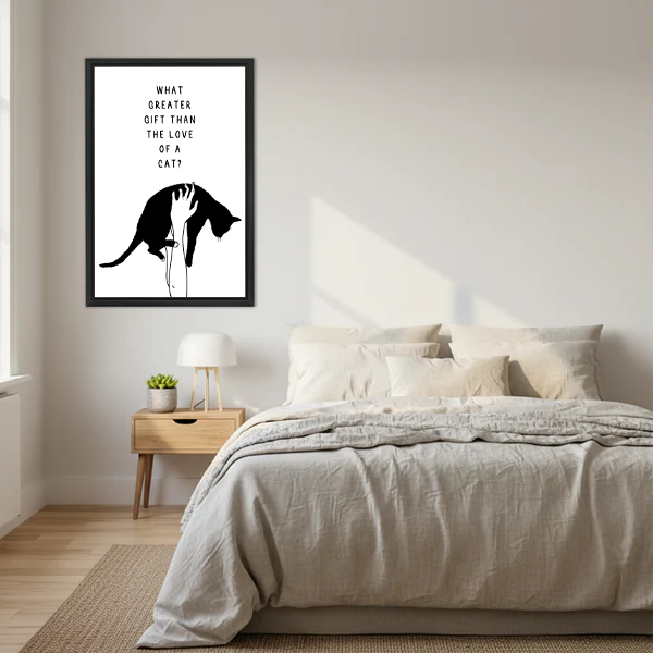 What greater gift than the love of a cat minimalist black and white cat quote framed wall art hung above linen bed with cream bedding wooden nightstand and small succulent in Scandinavian bedroom