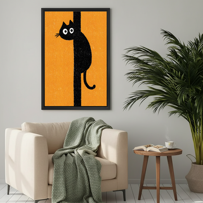 Funny black cat clinging to pole cartoon framed wall art print on bold orange background above beige armchair in cozy living room