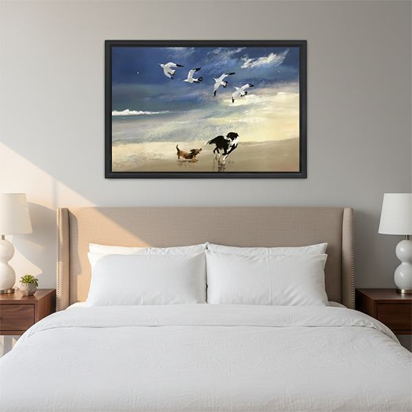 Framed canvas beach dogs chasing seagulls wall art in bedroom setting