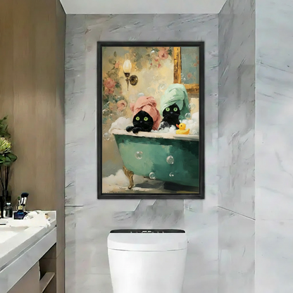 Two whimsical black cats in bubble bath framed canvas wall art displayed in modern marble bathroom