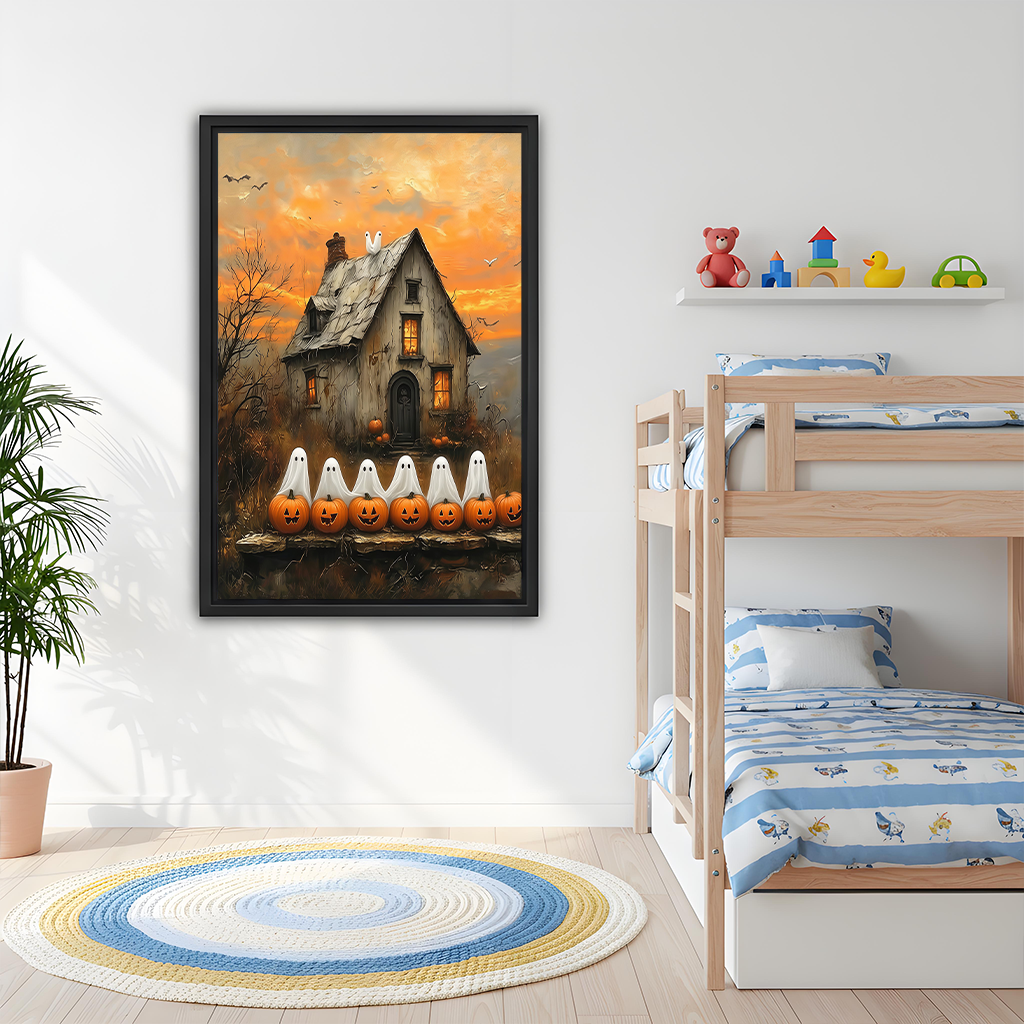 Woman holding framed Halloween ghost cottage canvas wall art featuring white ghosts, pumpkins, and a warm orange sunset.