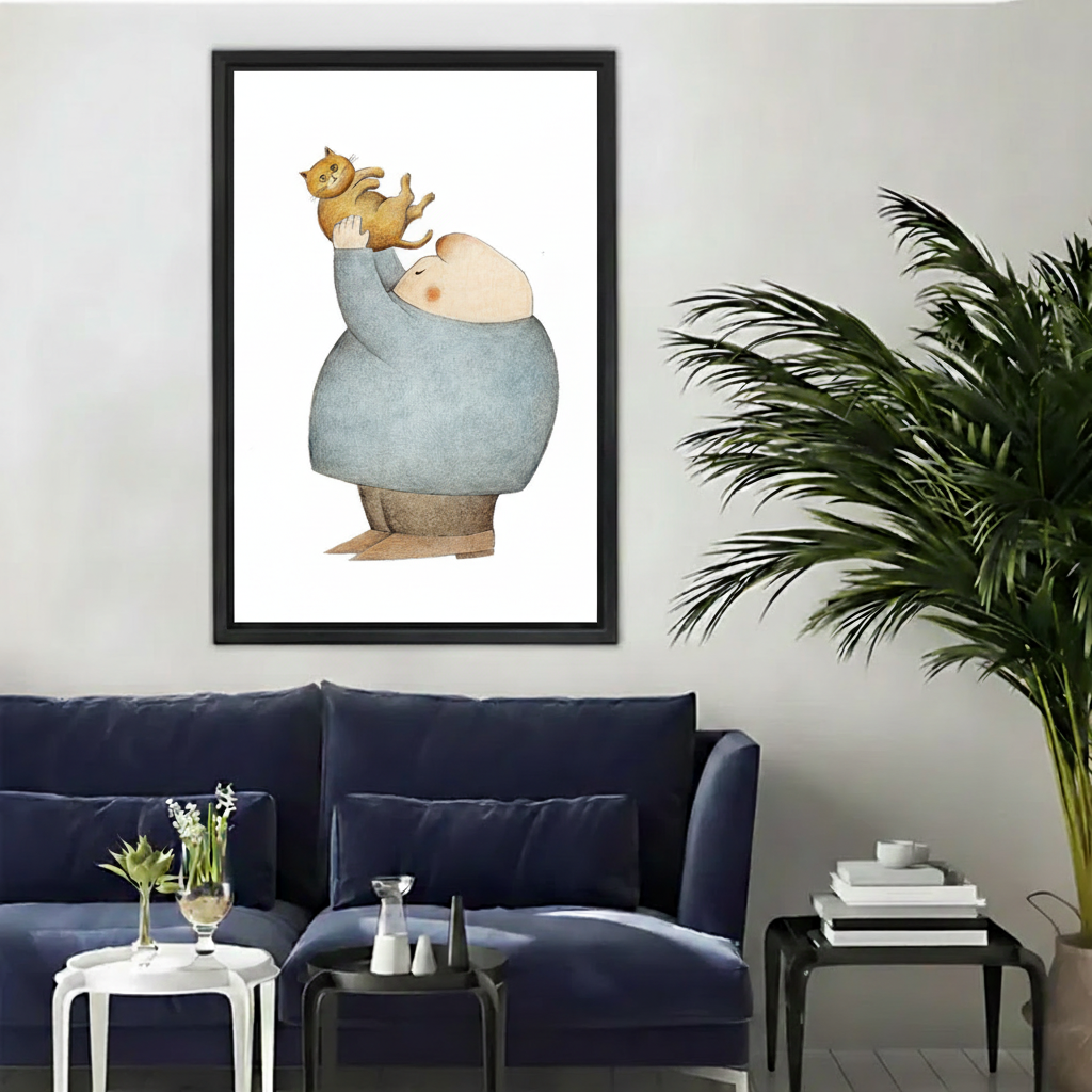 Fat Man Lifting Cat Framed Canvas Art Print – black frame on grey wall above navy blue sofa, modern interior