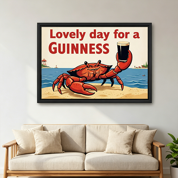 Retro Guinness crab canvas wall art in a black frame above a cream sofa with wooden armrests.