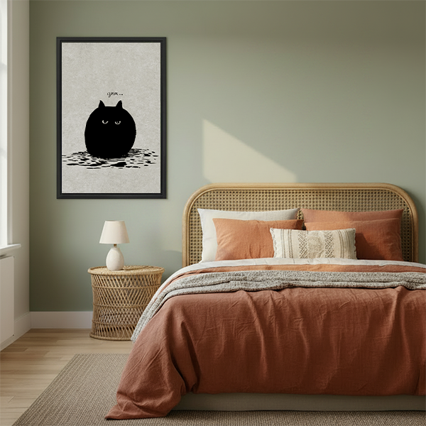 Round grumpy black cat grrr minimalist framed canvas wall art hanging in cozy boho bedroom above rattan bed with terracotta bedding and rattan nightstand