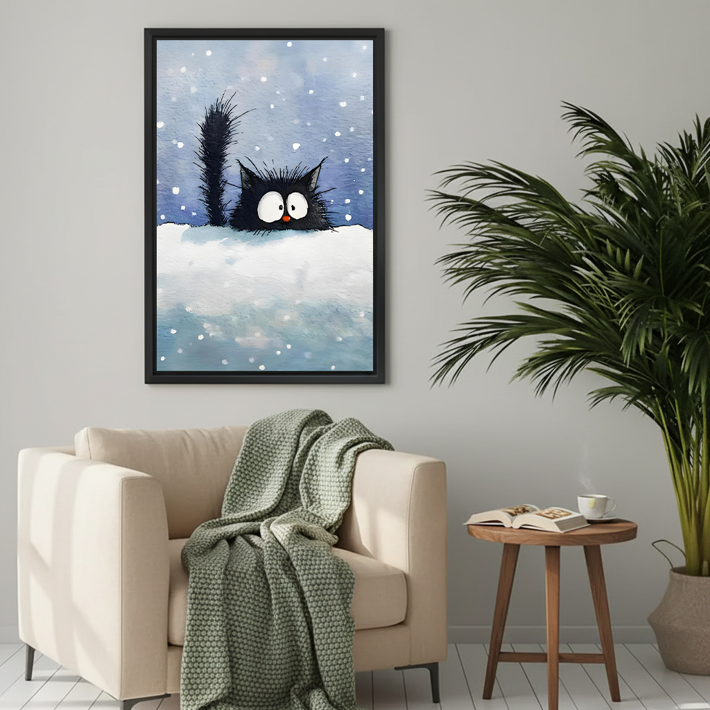 Whimsical black cat snow art print in black frame above cozy beige armchair in neutral living room

