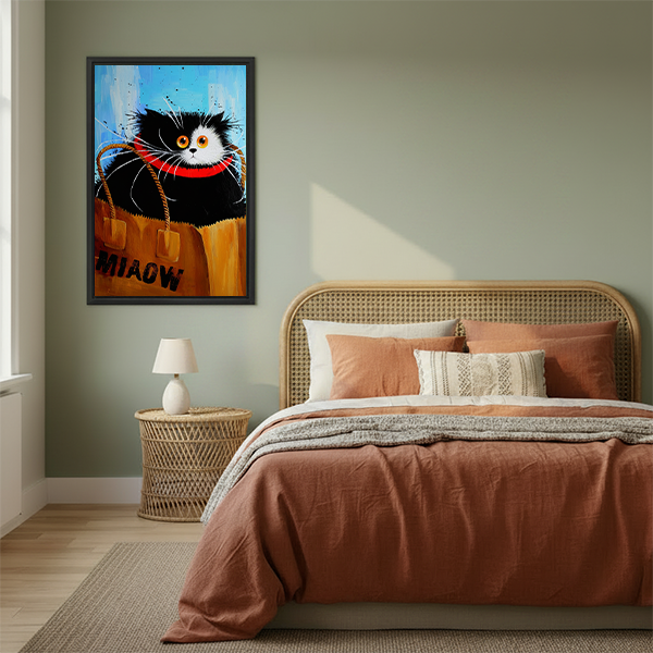 Black and white cat with orange eyes and red collar sitting inside MIAOW shopping bag funny oil painting style framed wall art hung on sage green wall beside rattan bed with terracotta bedding wicker nightstand and white table lamp in boho bedroom