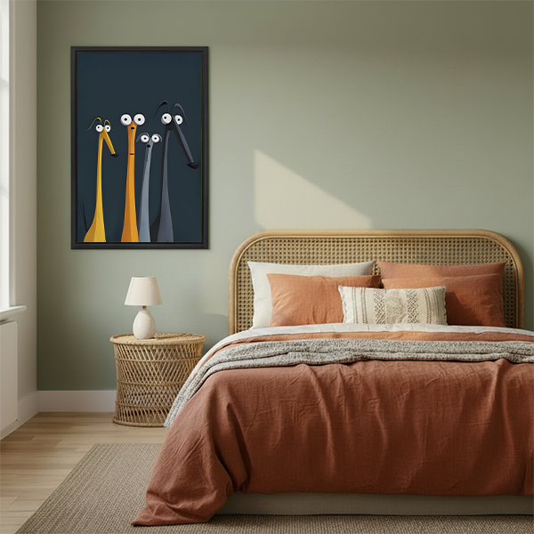 Framed whimsical black cat winter print displayed on sage green bedroom wall above rattan headboard