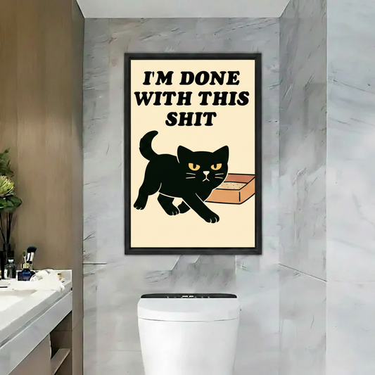 Funny black cat litter box wall art print in black frame above toilet in marble bathroom, humorous retro poster