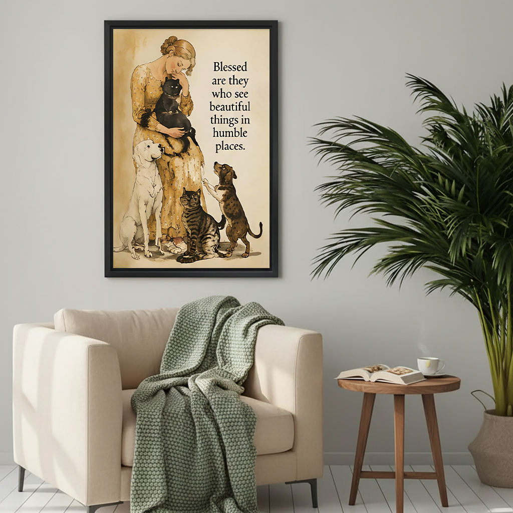 Woman in yellow floral dress holding black cat surrounded by white labrador tabby cat and dachshund vintage watercolor illustration with blessed beautiful things humble places quote framed wall art hung on grey wall above cream armchair with sage green knit throw wooden round side table open book and coffee cup beside palm plant