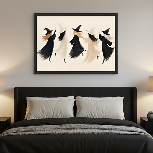Framed minimalist witch coven Halloween canvas wall art displayed above a wooden console with greenery