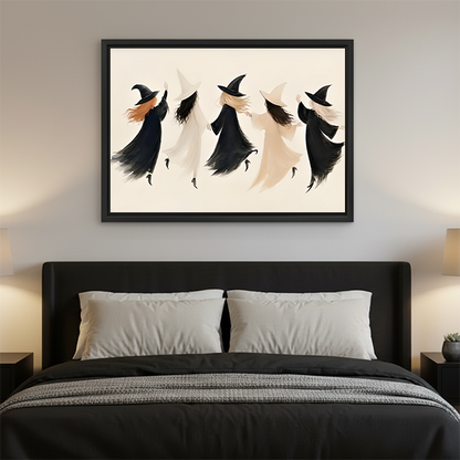 Framed minimalist witch coven Halloween canvas wall art displayed above a wooden console with greenery