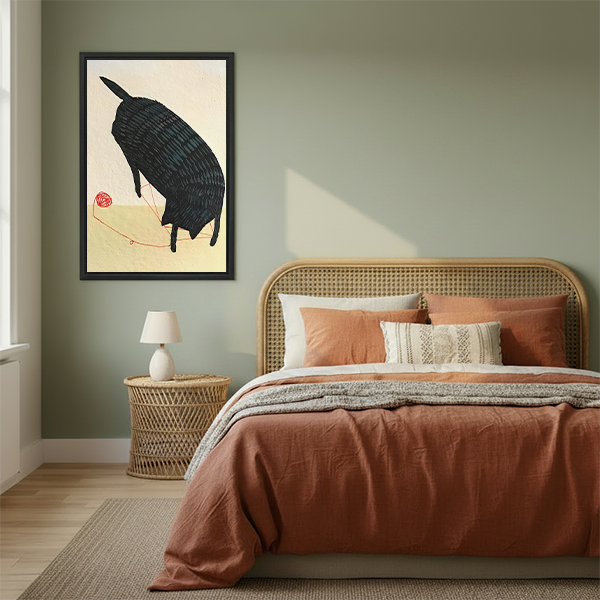 Japanese style black cat red yarn minimalist framed canvas art in black frame above rattan bed with terracotta bedding in sage green bedroom