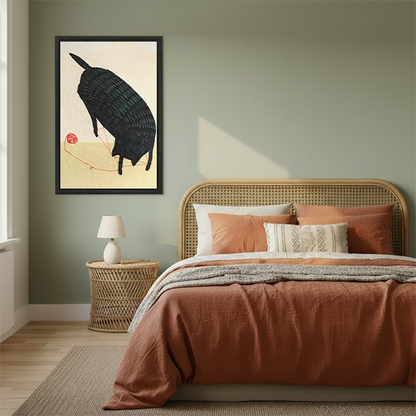 Japanese style black cat red yarn minimalist framed canvas art in black frame above rattan bed with terracotta bedding in sage green bedroom