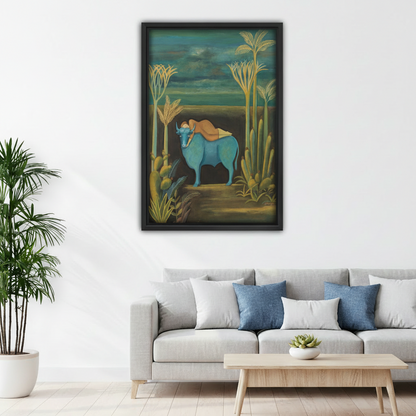 Black framed blue bull surrealist wall art above a gray sofa in a bright modern living room, statement art print for home decor