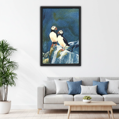 Coastal puffin birds oil painting black framed canvas print above white sofa in minimalist Scandinavian living room
