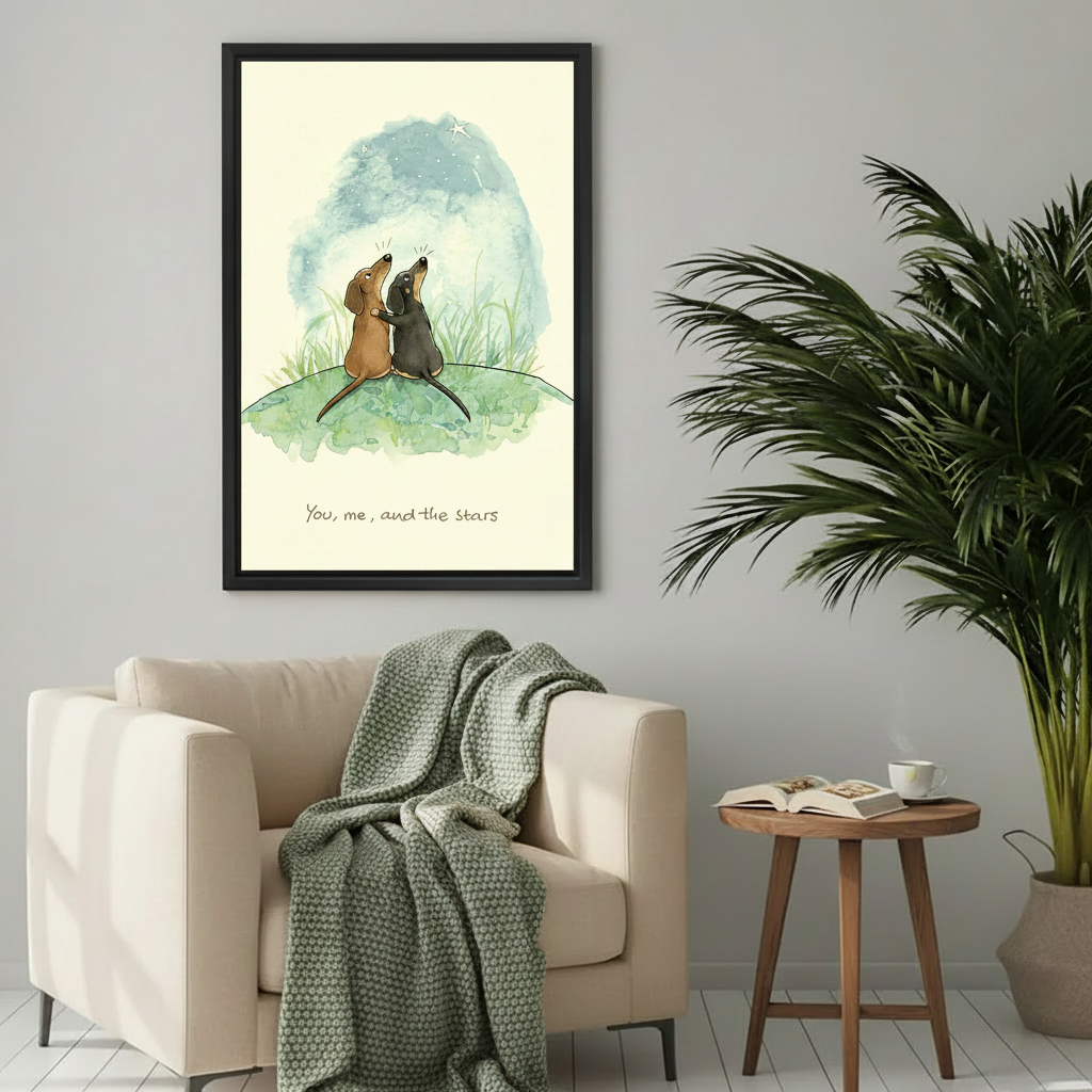 Sweet dachshund pair stargazing night sky you me and the stars watercolor wall art print in black frame beside cream armchair with green knit throw and round wood side table in Scandinavian living room