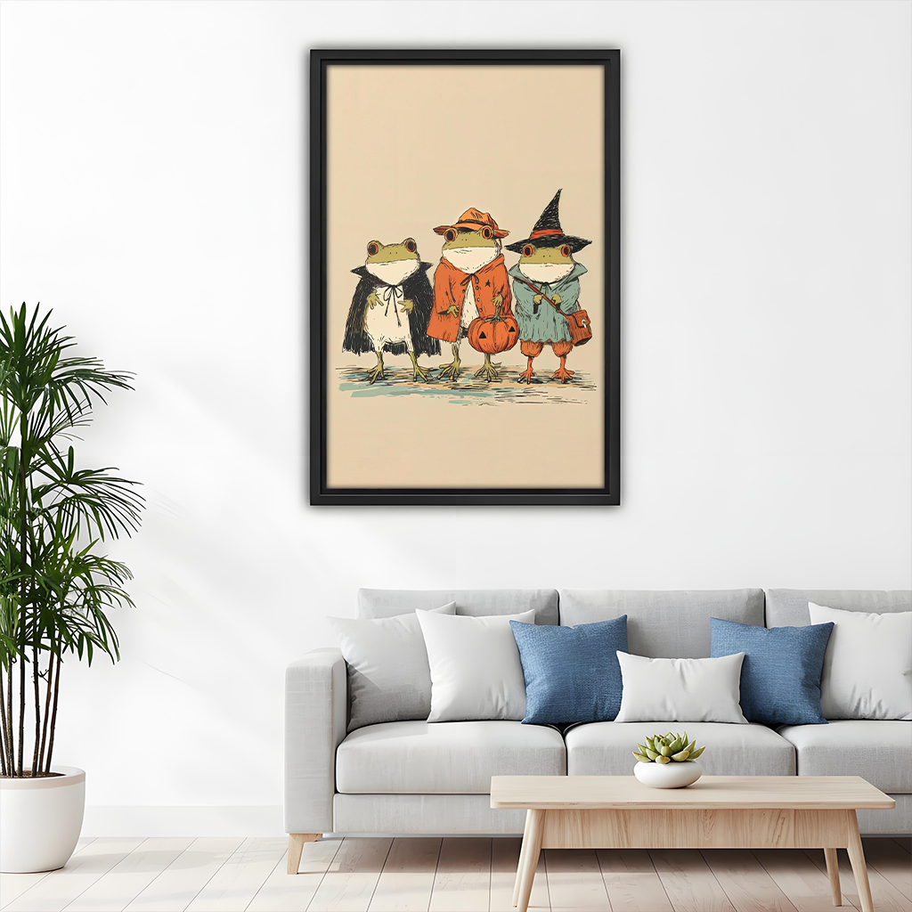 Black-framed whimsical Halloween frogs canvas wall art beside wooden bunk beds beneath a shelf of colorful toys.