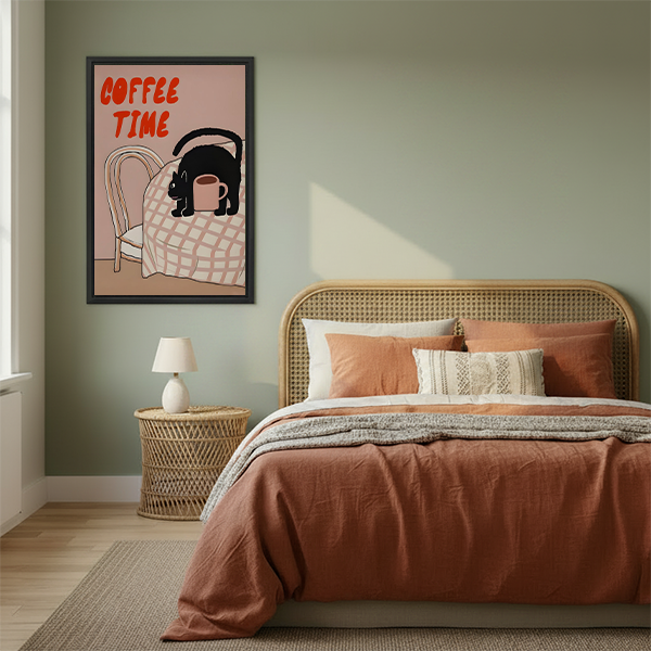 Framed Coffee Time black cat canvas wall art beside a rattan bed with terracotta bedding in a green bedroom.