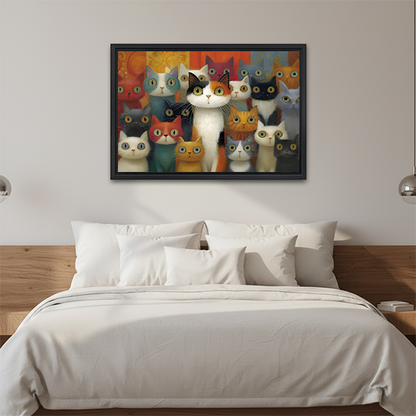 Black-framed colorful cats canvas wall art with a crowd of curious cats displayed above a bed with white pillows.