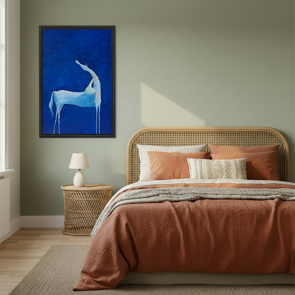 Mystical blue deer framed art print in boho bedroom above rattan bed