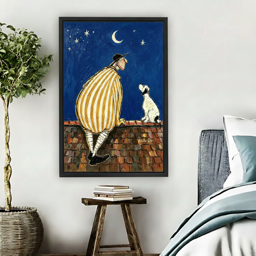 Man and dog sitting on rooftop watching moon stars night sky oil painting wall art print in black frame above wooden stool with books and wicker basket in boho bedroom