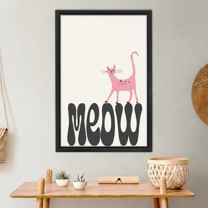 Funny pink cat standing on meow typography wall art print in black frame above wooden entryway bench with wicker basket and succulent in boho hallway
