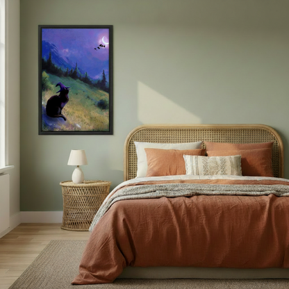 Fantasy witch cat canvas print in black frame hanging in sage green bedroom with rattan headboard